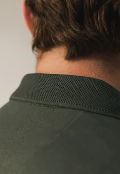 Polo met structuurgebreide kraag
